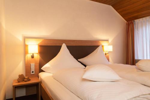 Postel nebo postele na pokoji v ubytování Hotel Kimmig
