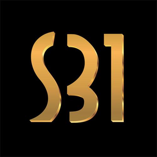 a gold letter s on a black background at School 31 Lofts in Rochester