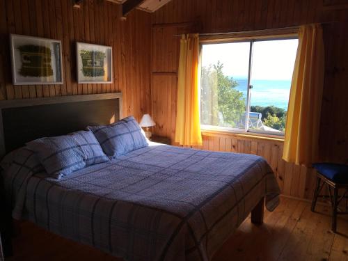 Ein Bett oder Betten in einem Zimmer der Unterkunft Cabañas Campomar