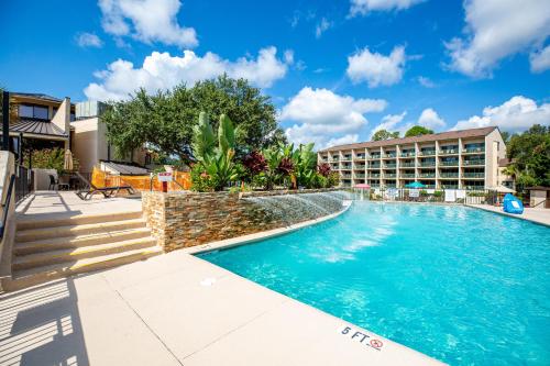 a swimming pool with a hotel in the background at Ocean View at Island Club by Capital Vacations in Hilton Head Island