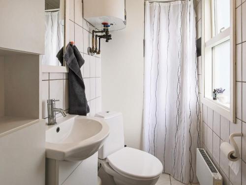 A bathroom at 5 person holiday home in J gerspris