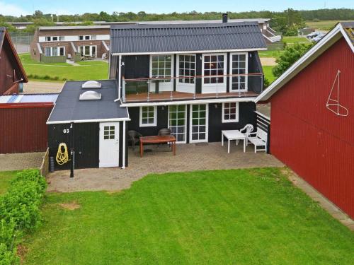 an aerial view of a house with a yard at 6 person holiday home in Hemmet in Falen