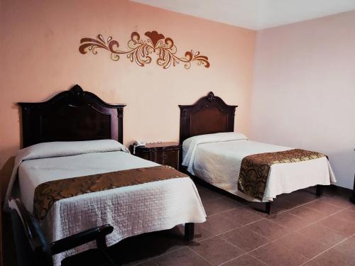 Llit o llits en una habitació de Hotel Casa La Gran Señora