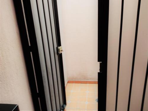 an open door to a room with a tile floor at Hotel Casa La Gran Señora in Tequila