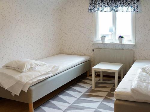 Ένα ή περισσότερα κρεβάτια σε δωμάτιο στο Five-Bedroom Holiday home in Hova 2