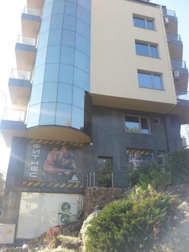 a building with a painting on the side of it at Sandanski Peak Guest Rooms in Sandanski