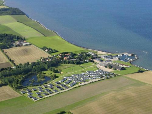 an aerial view of a parking lot next to the water at 6 person holiday home in Tranek r in Fæbæk