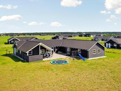 an aerial view of a house with a playground at 20 person holiday home in L kken in Nørre Lyngby