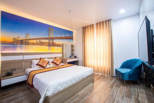 a hotel room with a bed and a painting of a bridge at HM Hotel& Apartment in Hai Phong