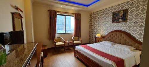 Säng eller sängar i ett rum på Hoang Yen Hotel