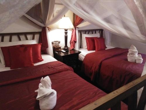 Letto o letti in una camera di Tri Yaan Na Ros Colonial House