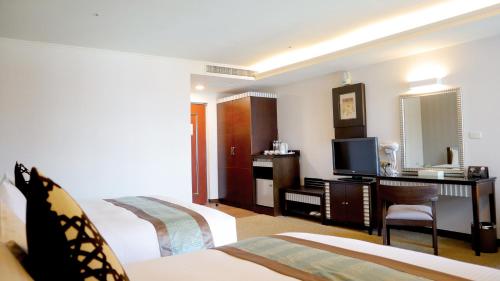 Ένα ή περισσότερα κρεβάτια σε δωμάτιο στο Zhong Ke Hotel