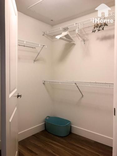a walk in closet with a blue bucket in a room at Perfect Apt near UCLA w Parking Gym Pool WIFI in Westwood B3 in Los Angeles