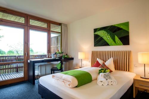 Postel nebo postele na pokoji v ubytování Hotel Alpenblick