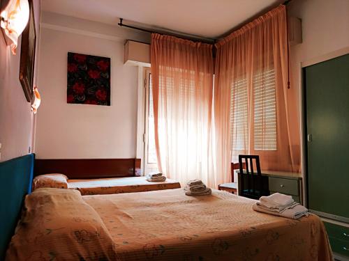Postel nebo postele na pokoji v ubytování Hotel Pecci