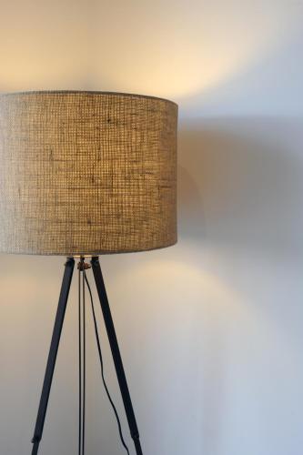a close up of a lamp with a brown shade at Relbia Lodge in Relbia