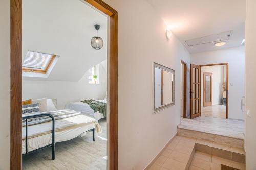 a room with a bed and a hallway at APTs in OLD TOWN PRAGUE by Michal&Friends in Prague