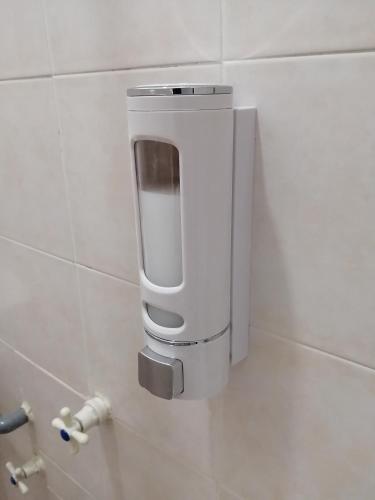 a urinal on a wall in a bathroom at SKYHOMESTAY TELOK PANGLIMA GARANG in Teluk Panglima Garang