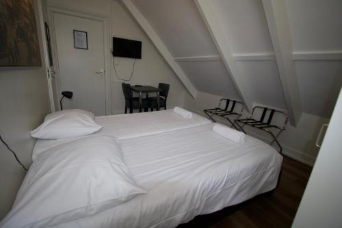 Una cama o camas en una habitación de Hotel Hortus