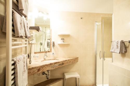 Ванная комната в Aktiv- und Wellnesshotel Traube- Post