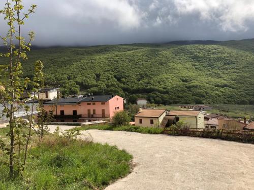 a small town with houses and a mountain at Hotel Campo Felice in Lucoli Alto