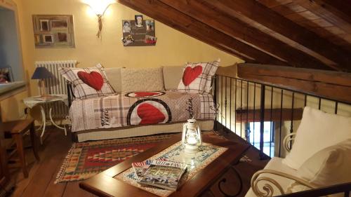a living room with a couch and a table at HOME SWEET HOME in Antey-Saint-André