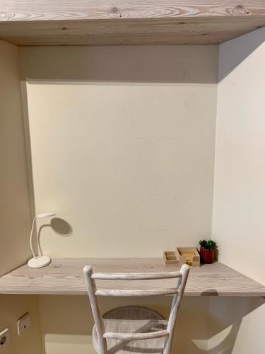 a chair sitting at a desk in a room at L'Heura in Navata