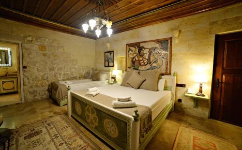 מיטה או מיטות בחדר ב-Caftan Cave Suites