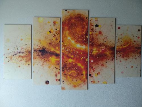 a bunch of paintings hanging on a wall at Antico Centro Quartu in Quartu SantʼElena