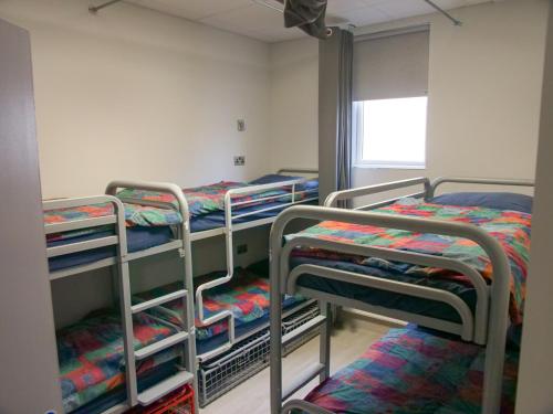 a group of bunk beds in a room at Abbey Court Hostel in Dublin