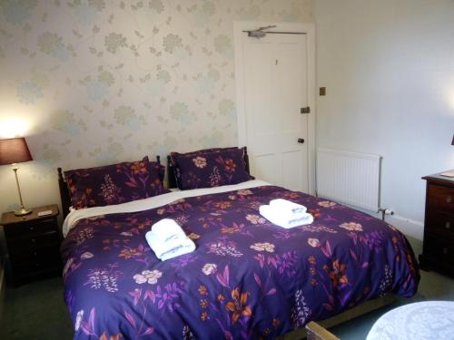 Ένα ή περισσότερα κρεβάτια σε δωμάτιο στο Dunallan Guest House