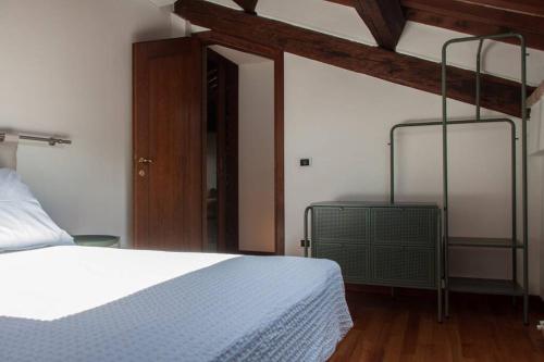 Ein Bett oder Betten in einem Zimmer der Unterkunft Attico Baggio