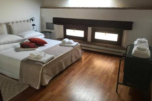 Ένα ή περισσότερα κρεβάτια σε δωμάτιο στο Attico Baggio