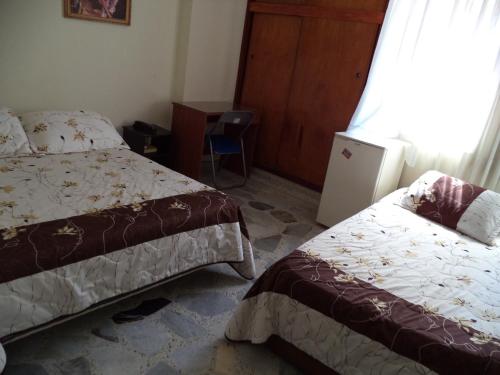 Postel nebo postele na pokoji v ubytování Hotel Mar Azul Inn
