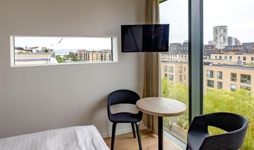 Μια τηλεόραση ή/και κέντρο ψυχαγωγίας στο Go Hotel City Apartments