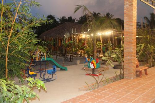 a playground in a resort with a play area at Bầu Bí Mini Farmstay Mekong - Tiền Giang in My Tho