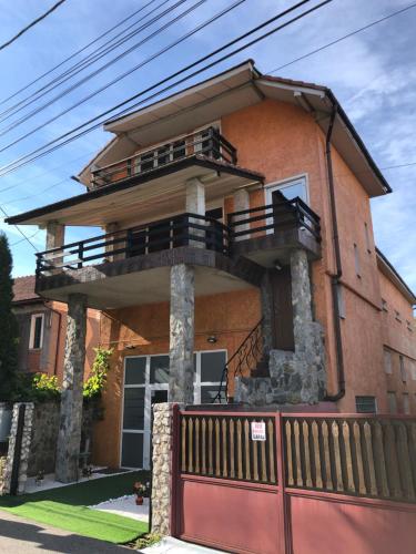 a building with a balcony on top of it at Casa B&D Residence in Deva
