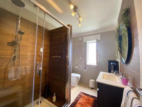 a bathroom with a shower and a sink at Casa de Manteigas in Manteigas
