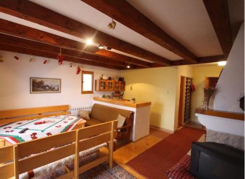 a bedroom with a bed and a couch in a room at Vlašićki Konak in Vlasic