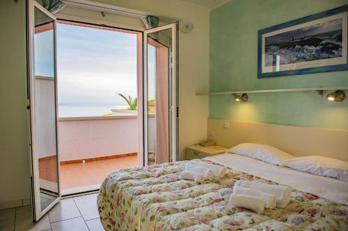 Кровать или кровати в номере Hotel del Sole