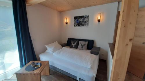 Postel nebo postele na pokoji v ubytování Alpenappartement Kleiner