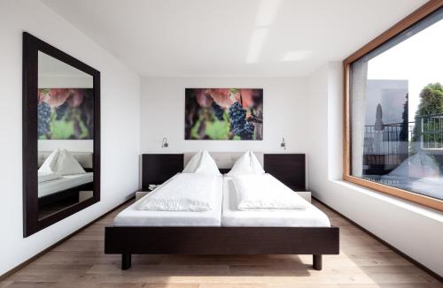 מיטה או מיטות בחדר ב-Villa Pernstich - modern apartments