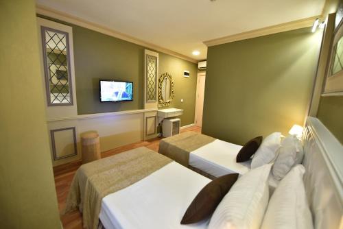 Katil atau katil-katil dalam bilik di Sunlight Hotel