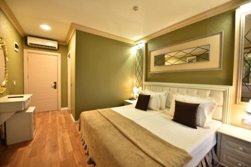 Katil atau katil-katil dalam bilik di Sunlight Hotel