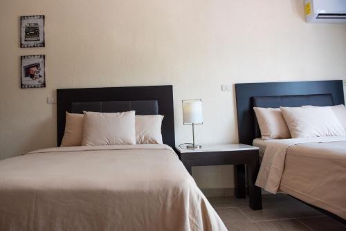 Ένα ή περισσότερα κρεβάτια σε δωμάτιο στο Hotel Casa Real