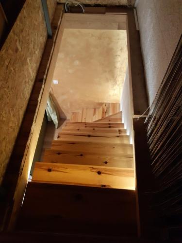 a staircase with wooden steps in a building at Kod Gruja in Ribnica