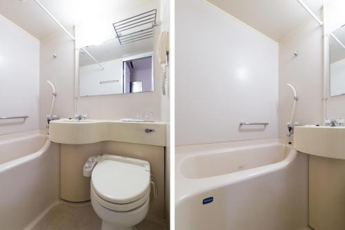a bathroom with a toilet and a sink and a tub at Tabist Hotel Tetora Kitakyushu in Kitakyushu