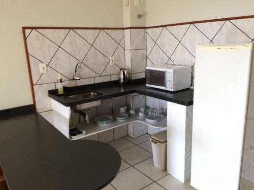 Virtuvė arba virtuvėlė apgyvendinimo įstaigoje Pousada Porto do Arvoredo