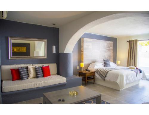 Una cama o camas en una habitación de Hotel Spa Sitio Sagrado