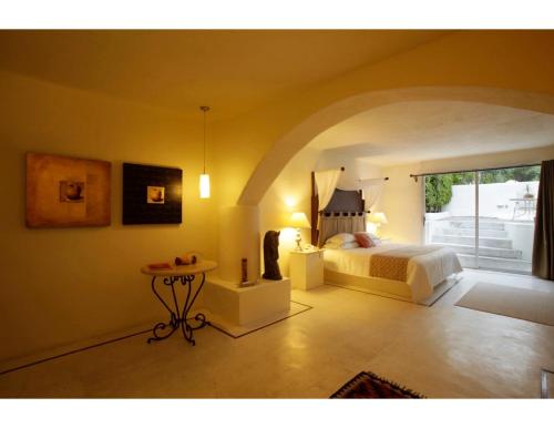 Una cama o camas en una habitación de Hotel Spa Sitio Sagrado